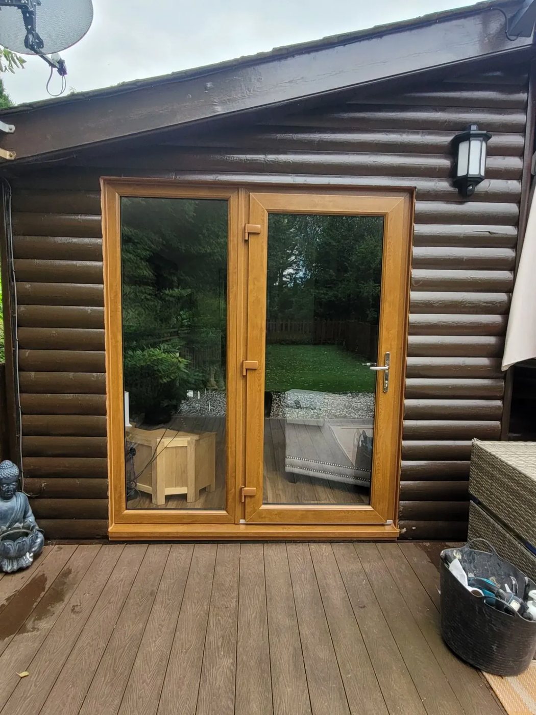 Golden oak uPVC French doors fitted to a timber lodge